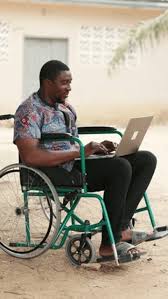 Customer using a laptop while seated in a wheelchair